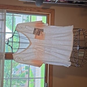 Cute Pol T-Shirt. Size L. White with "peachy" accents